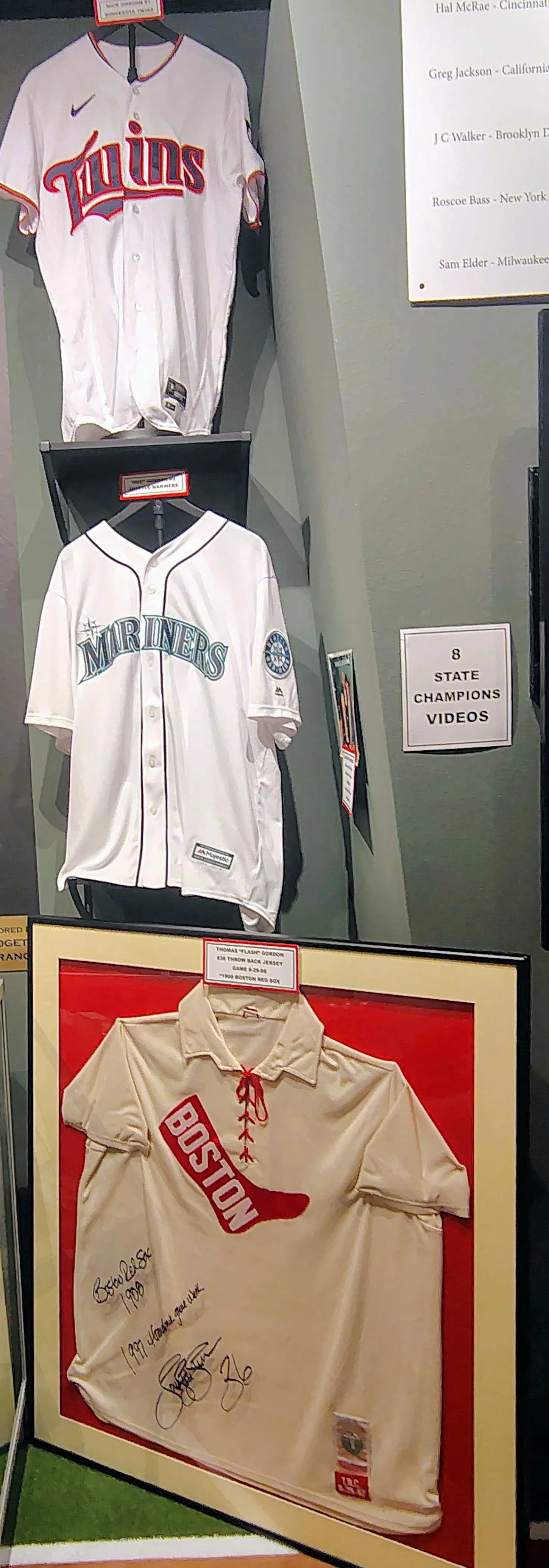 Dee Strange-Gordon’s white Seattle Mariners jersey hanging between uniforms of Nick Gordon and Tom Gordon.