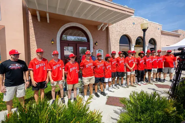 The Devils team, lined up in front of the Depot, closer.