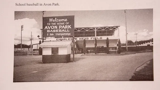 A sign reading Welcome to the home of Avon Park Baseball, Charles Head Field.