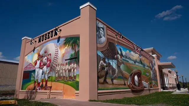 The corner of the museum building with its murals and Museum lettering.