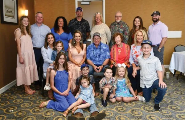 Some twenty members of the Weekley family, from grandparents to small children, gathered for a group photograph.